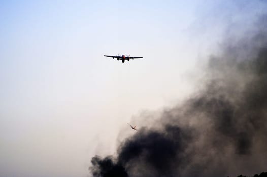 Tracker water bomber in the sky of southern France from extinguishing a forest fire.