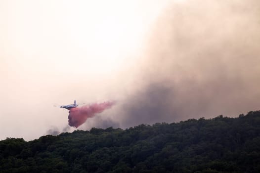 Tracker water bomber in the sky of southern France from extinguishing a forest fire.