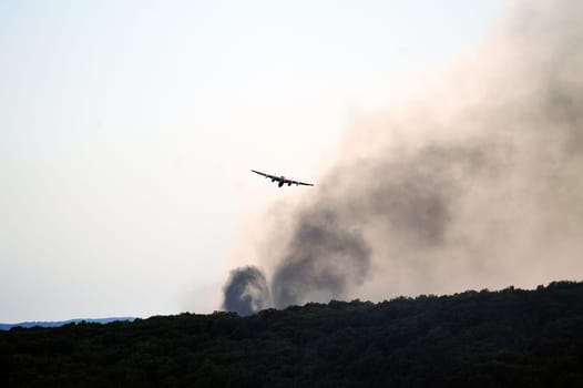 Tracker water bomber in the sky of southern France from extinguishing a forest fire.