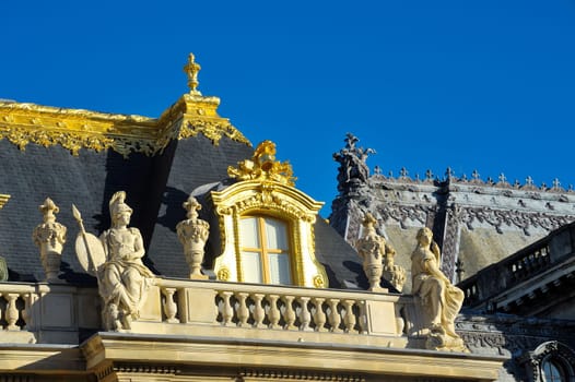 chateau de Versailles, architectural detail and gilding of the facade and roof