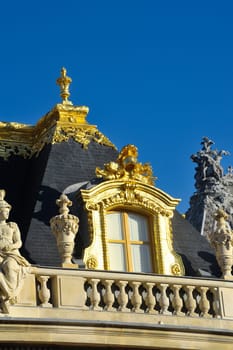 chateau de Versailles, architectural detail and gilding of the facade and roof