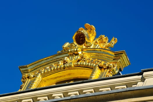 Castle of Versailles, architectural detail and gilding of the facade and roof