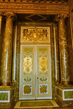 a monumental gate of the castle of Versailles