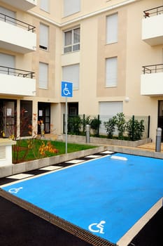 Parking space for disabled before a new building