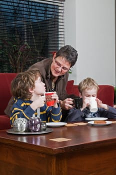 Family with two brothers and grandma in a livingroom