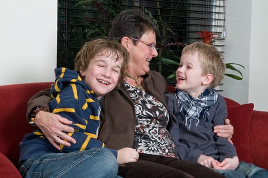 Family with two brothers and grandma in a livingroom