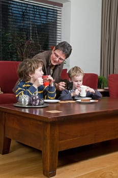 Family with two brothers and grandma in a livingroom