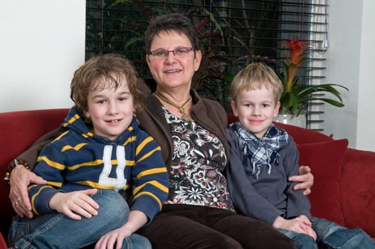 Family with two brothers and grandma in a livingroom