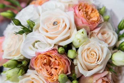Close-up view of a bridal bouquet made of roses pale roses