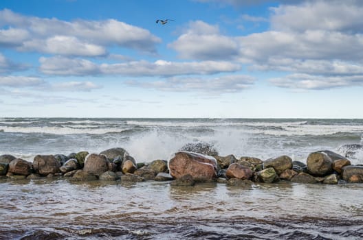 Sea waves breaking on the rocks, seascape