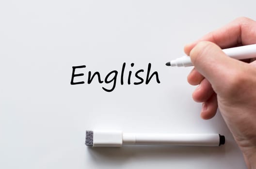 Human hand writing english on whiteboard
