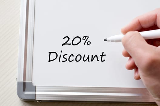Human hand writing twenty percent on whiteboard