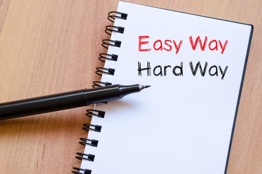 Easy way hard way text concept write on notebook