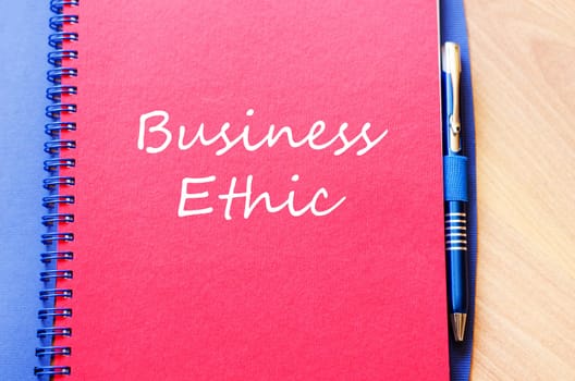 Business ethic text concept write on notebook