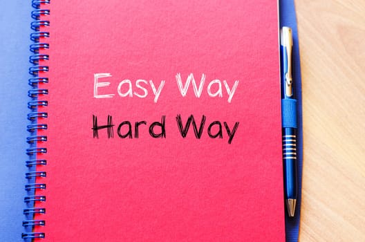 Easy way hard way text concept write on notebook