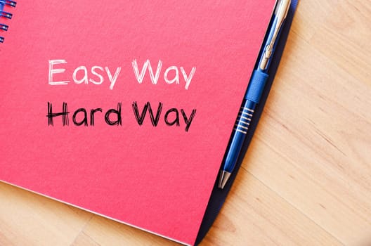 Easy way hard way text concept write on notebook