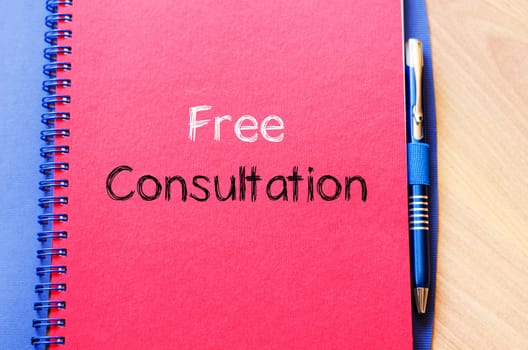 Free consultation text concept write on notebook