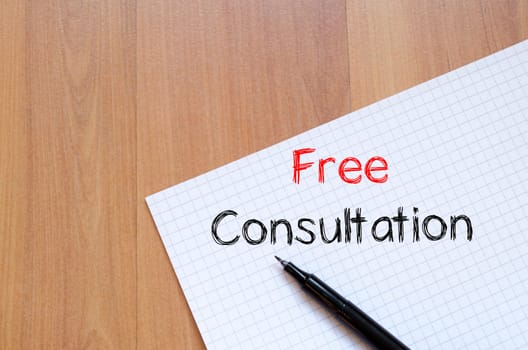 Free consultation text concept write on notebook