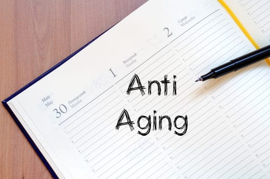Anti aging text concept write on notebook
