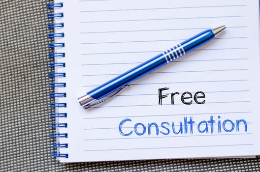 Free consultation text concept write on notebook
