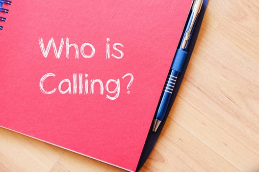 Who is calling text concept write on notebook