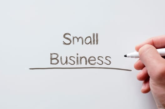 Human hand writing small business on whiteboard
