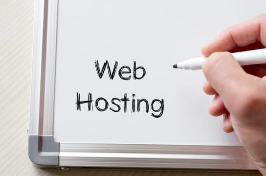 Human hand writing web hosting on whiteboard