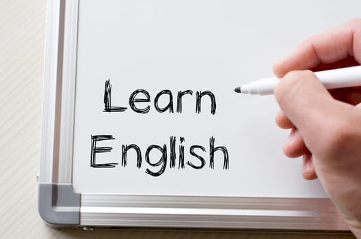Human hand writing learn english on whiteboard