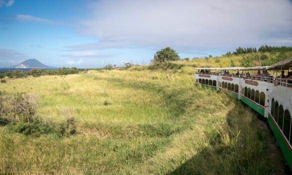 SAINT KITTS, CARIBBEAN, 29 DECEMBER 2015 - The scenic railway on the island of St Kitts with the island of Nevis in the distance