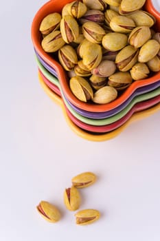 Pistachio Nuts on Colorful Bowls From Top View