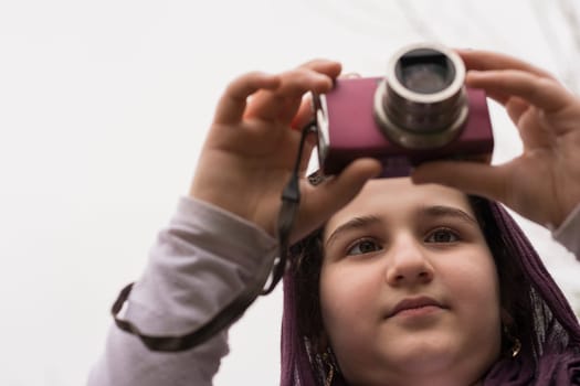 Young Little Girl Is Taking Photograph by Point and Shoot Digital Camera