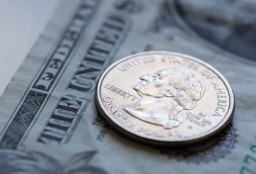 Quarter on US Dollar Bill Close up.