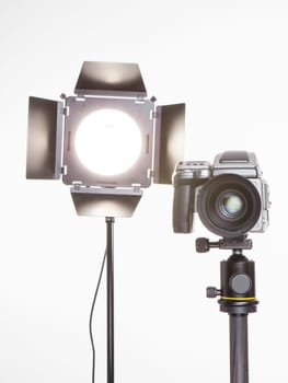 camera and light in a professional studio a camera and light