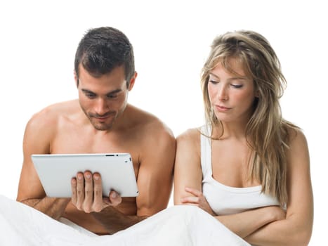 angry woman while his partner is watching a tablet