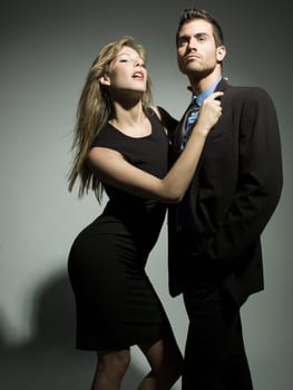 glamour attractive man and woman posing in the studio