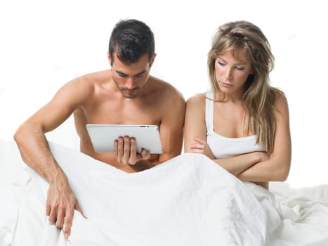 angry woman while his partner is watching a tablet