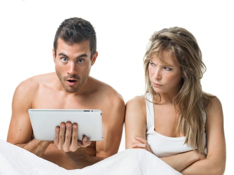 angry woman while his partner is watching a tablet