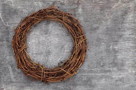 round christmas tree wreath on grunge wood background