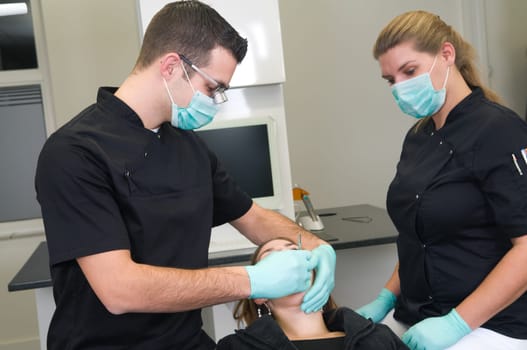 Patient getting a treatment at the dental practice