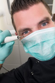 Picture of the dentist, as seen from the patient's point of view, lying in the chair