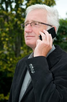 Businessman using a smartphone while being outside