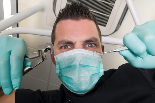 Picture of the dentist, as seen from the patient's point of view, lying in the chair