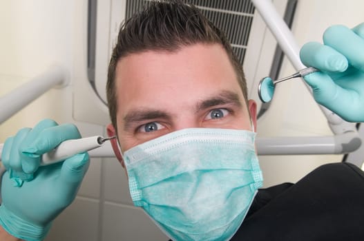 Picture of the dentist, as seen from the patient's point of view, lying in the chair