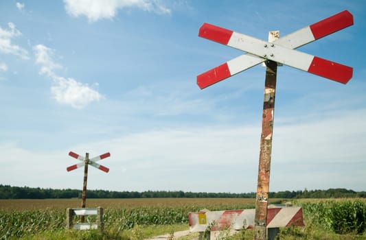An old railway sign near a small railway in Holland, Netherlands.