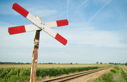 An old railway sign near a small railway in Holland, Netherlands.