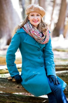 blond casual woman happy outdoors in the woods