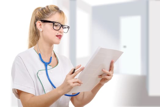 a nice female doctor writing her diagnosis in the hospital