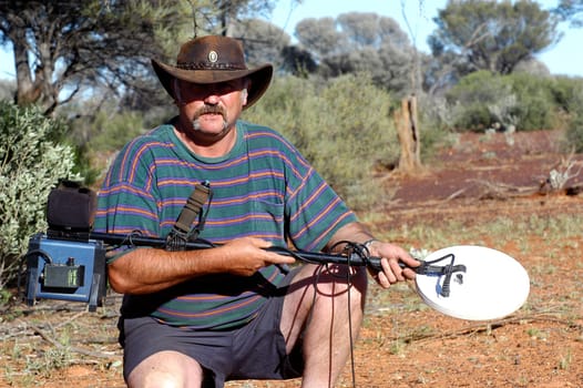 Gold digger in the Australian desert before the departure for hunting for the gold nuggets