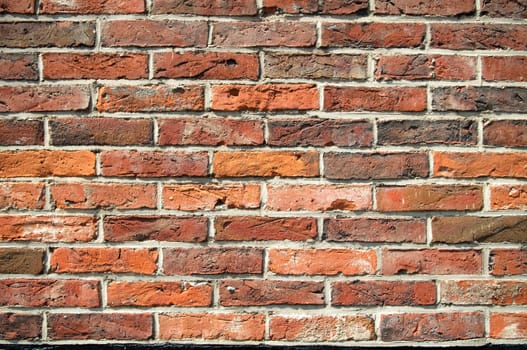 Texture of and old wall with colored bricks