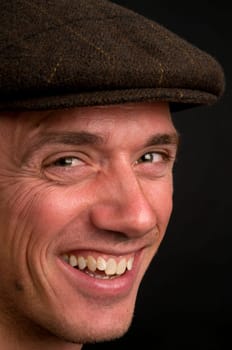 Portrait of an attractive young man with a hat.